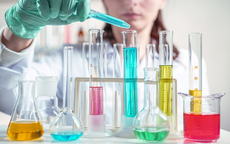 adulteration: picture o chemist combining different substances in test tubes adulteration: picture o chemist combining different substances in test tubes