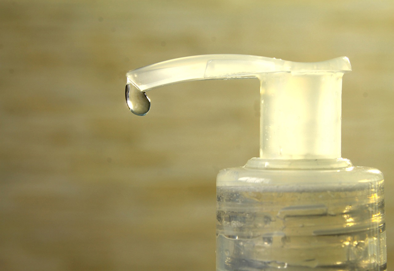 picture of a bottle with a drop of gel coming out of it. picture of a bottle with a drop of gel coming out of it.